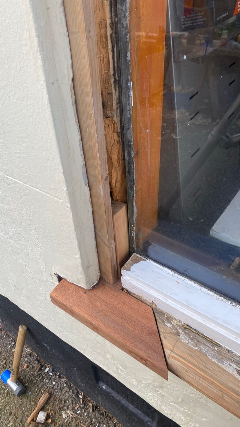 New cill going in, with the rot cut out of the window frame